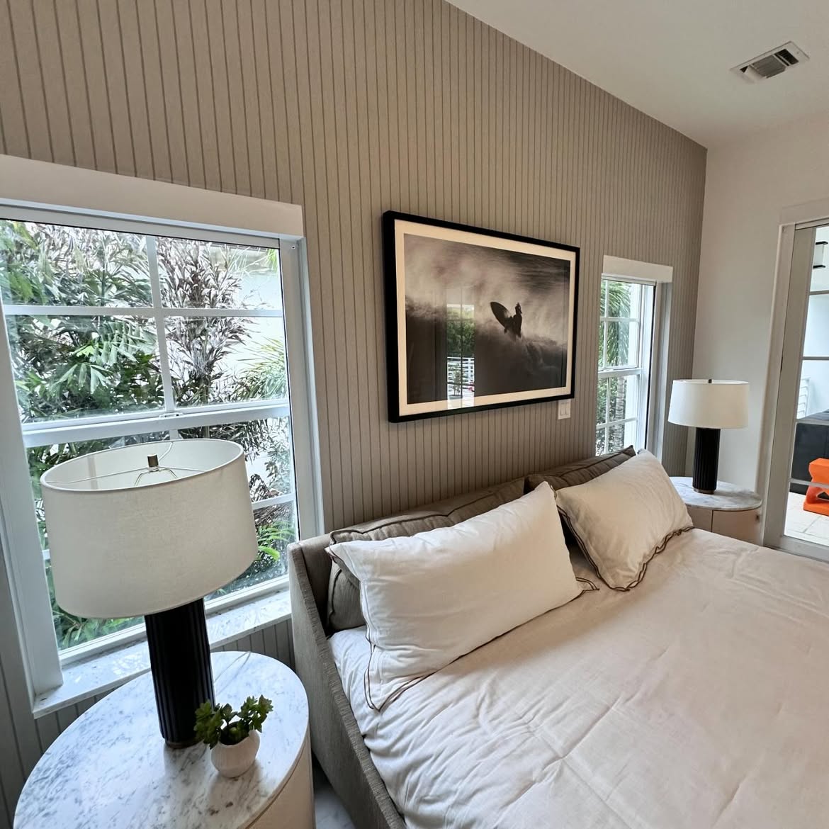 Detailed view of taupe linear wallcovering in a luxury bedroom