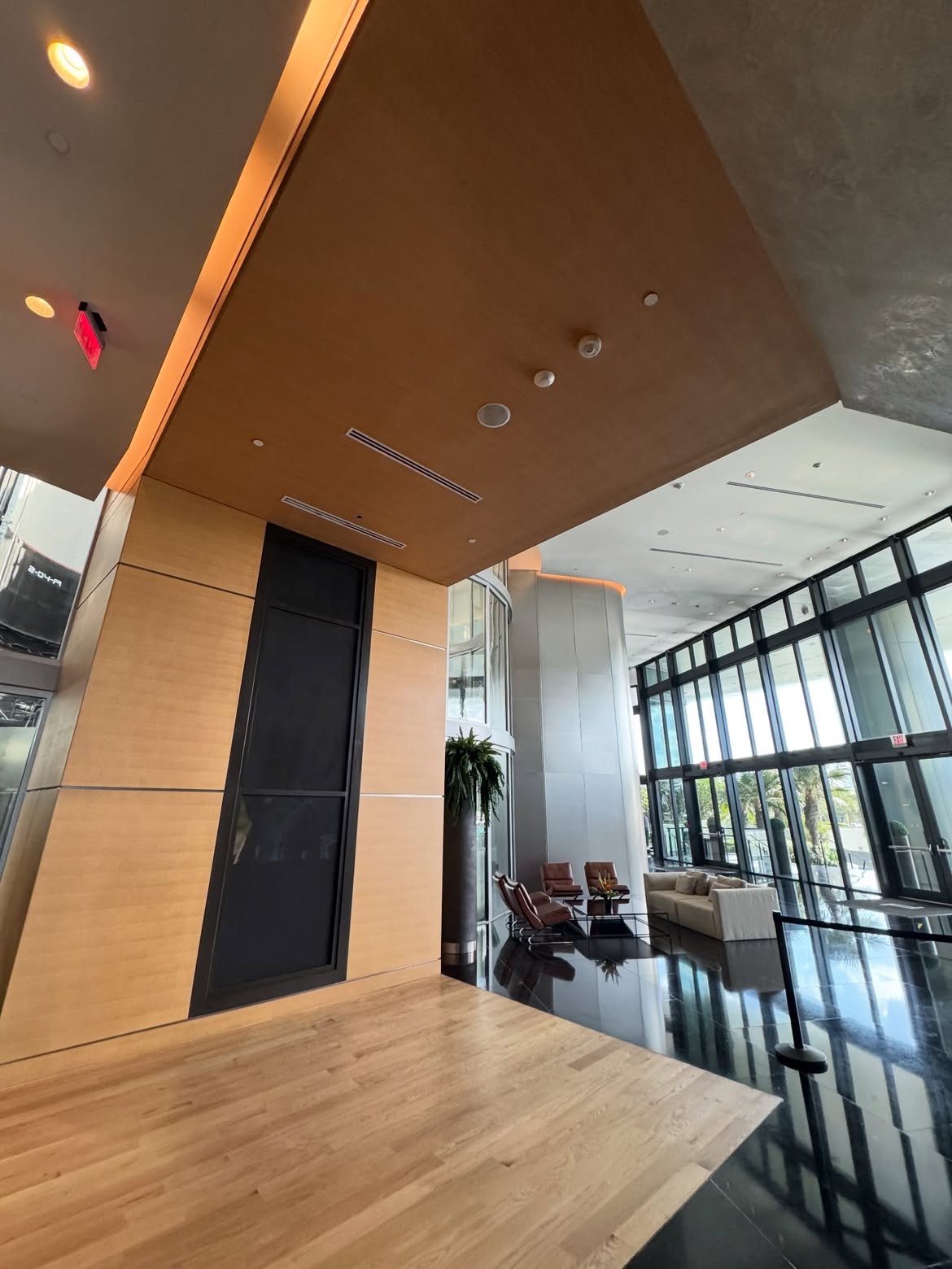 Wood-effect wall finish installed in a Porsche Design lobby