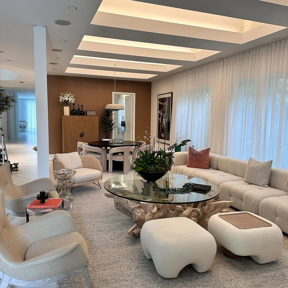 Warm luxury living and dining room with brown textured wallcovering